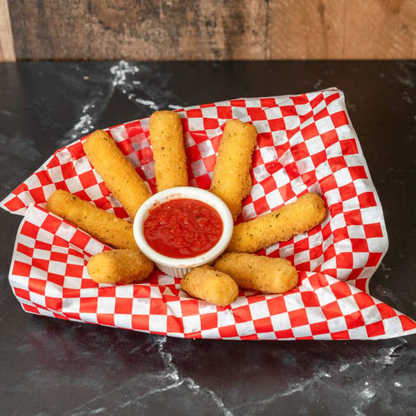 Piccolo Pizza & More mozzarella sticks in a red and white checkered paper basket with marinara sauce.