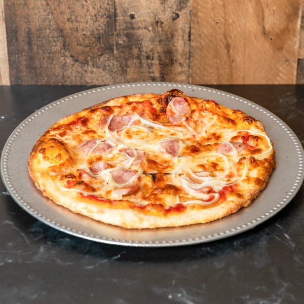 Piccolo Pizza & More's pizza with sausage and onions on a metal tray.